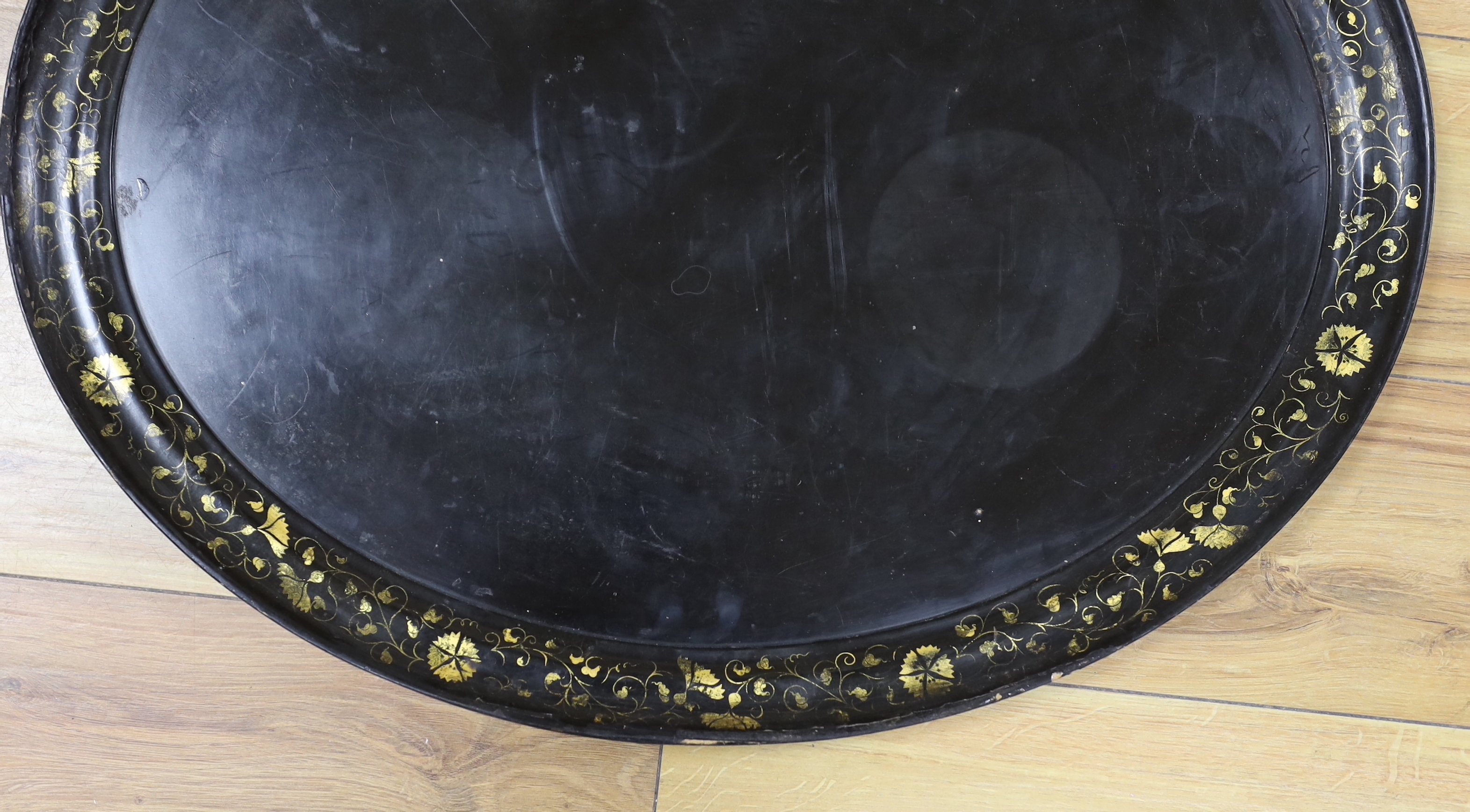 A Victorian paper mache tray with gilt decorated border, 51 x 63cm